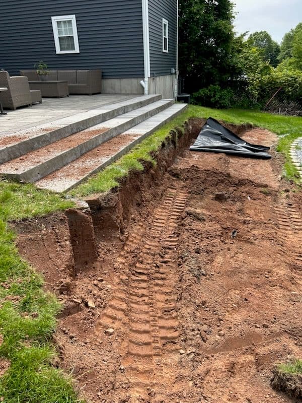 Transform Your Yard with Cote's Boulder Wall
