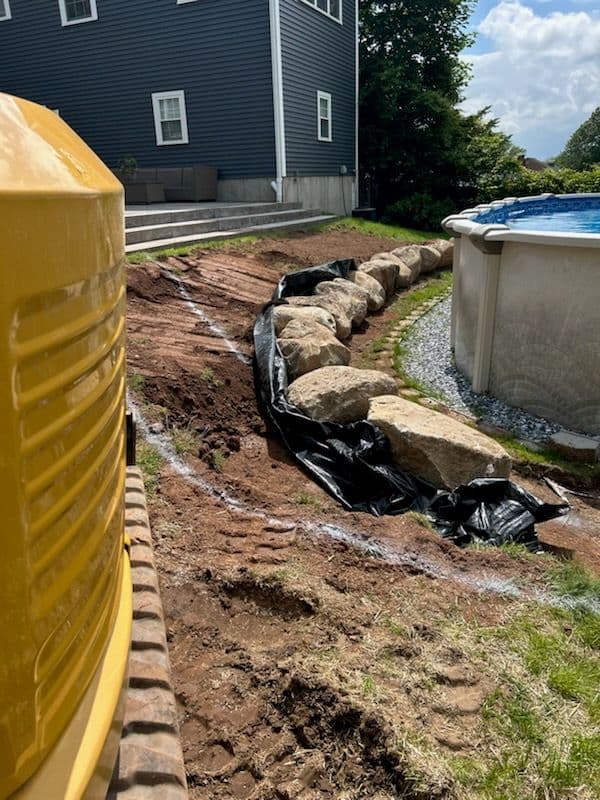 Transform Your Yard with Cote's Boulder Wall